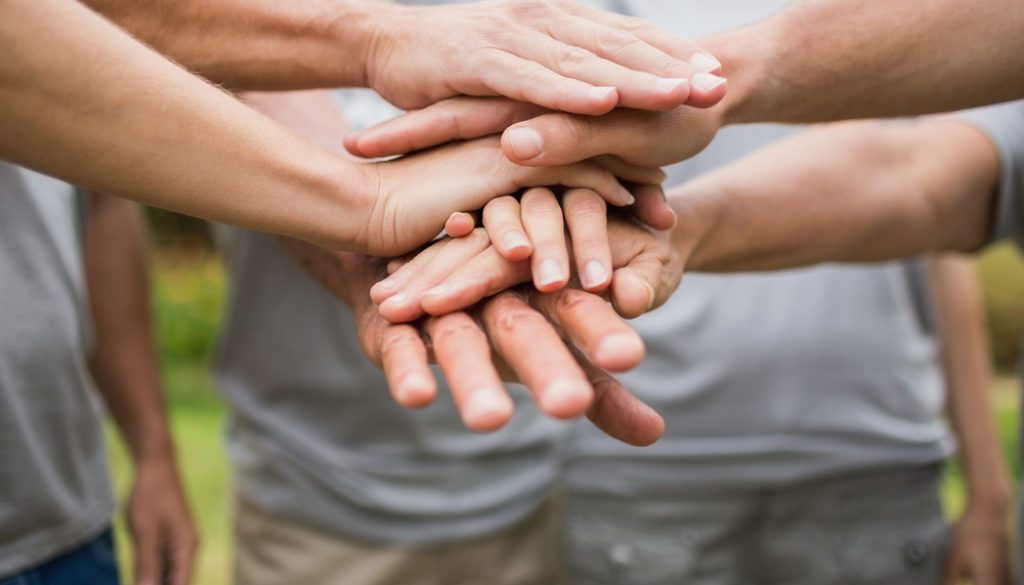 hands stacked together